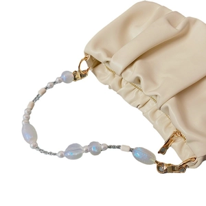 Chic off-white pleated cloud bag with colorful iridescent pearl and bead handle strap