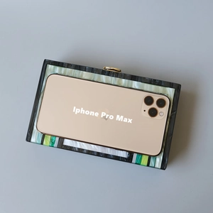 Macro view of acrylic clutch showing interior capacity for an iPhone Pro Max