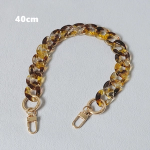 Close-up of 40cm amber tortoiseshell resin chain with gold spring clasps for handbags