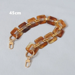 Detail of 45cm amber resin chain strap with gold metal links and lobster clasps