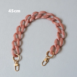 Detail of 45cm candy color acrylic bag chain with pink marble effect and gold hardware