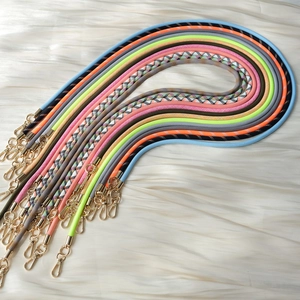 Detail of woven crossbody phone straps with premium gold swivel lobster clasps