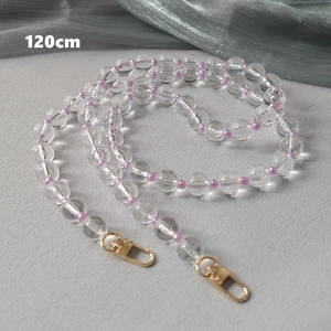 Detail of 120cm clear and purple acrylic bead strap with golden lobster metal clasp