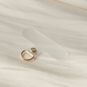 Close-up of frosted TPU phone lanyard tether tab with a premium gold metal D-ring buckle