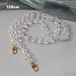 Macro view of 120cm beaded chain strap with transparent ripples and gold lobster clasps