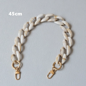 Detail of 45cm acrylic chain strap with marble texture and gold metal lobster clasps