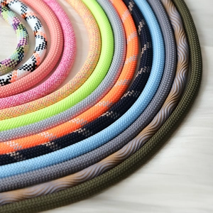 Detailed close-up of colorful braided nylon phone lanyards with various patterns and textures
