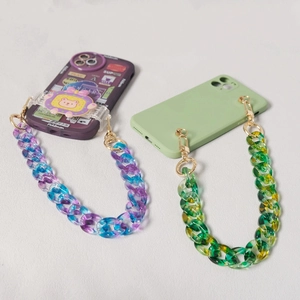 Detail of colorful fishbone acrylic resin phone chains with gold metal hooks and clasps