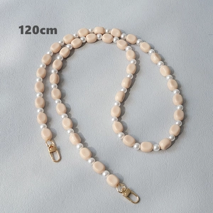 Detail of 120cm cream acrylic bead and pearl strap with gold metal lobster clasp