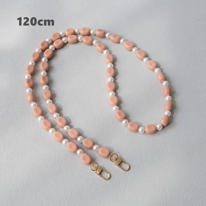 Detail of 120cm peach acrylic bead and white pearl strap with gold lobster clasps