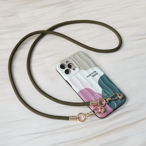 Detail of color-block phone case with olive green woven strap and metal carabiners