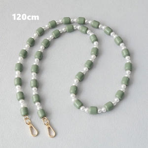 Detail of 120cm green acrylic beads and white pearl crossbody chain with gold clasp