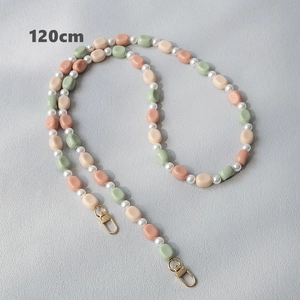 Detailed view of candy color resin beads and white pearls for bag strap or phone lanyard