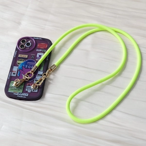 Detail view of neon green braided phone strap with gold lobster clasps on purple case