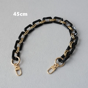 Detail of 45cm black acrylic and gold metal resin chain strap for bags or phones