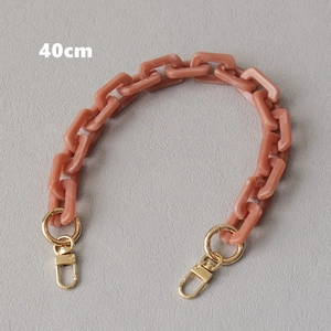 Detail of 40cm acrylic chain with coral pink marble texture and gold lobster clasps