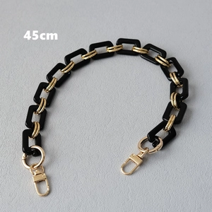Detailed view of 45cm black resin and gold metal chain strap with lobster clasps