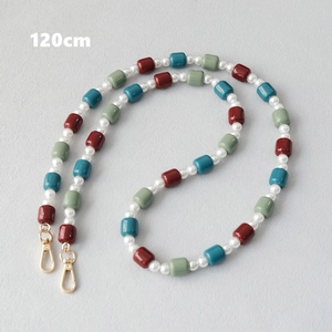 Detailed view of 120cm colorful beaded strap with pearls and golden lobster clasps