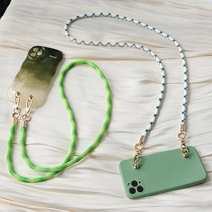 Detail of woven phone lanyards with forest green cases and golden metal hooks