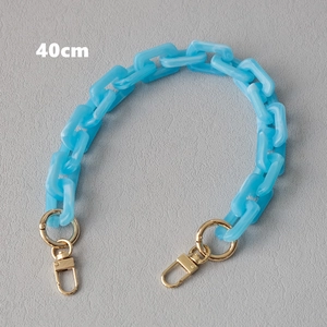Close-up of a 40cm sky blue acrylic resin chunky chain strap with golden metal clasps
