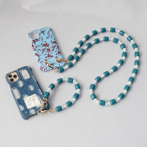 Detail of candy-colored acrylic bead phone straps with crossbody and hand-held lanyards