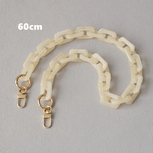 Detail of 60cm cream white acrylic link chain strap with gold metal lobster clasps