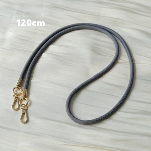 Detailed view of grey braided 120cm phone strap with golden metal lobster clasps