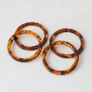 Macro shot of 11.8cm vintage amber resin ring handles for DIY handmade purses