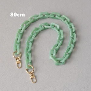 Detail view of an 80cm mint green acrylic resin chain strap with gold lobster clasps