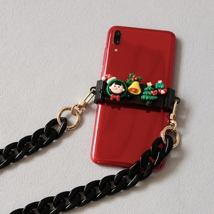 Detailed view of Christmas phone clip with black acrylic chain and resin charms on red phone