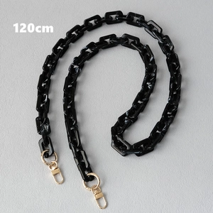 Detail of 120cm black marble resin bag chain with gold lobster clasps and hardware
