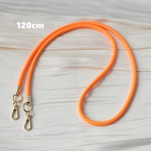 Detailed view of a 120cm orange woven crossbody strap with gold swivel lobster clasps