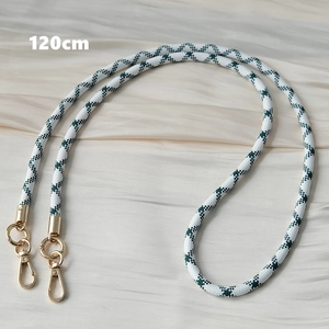 Green and white checkered woven phone strap with gold metal buckles, 120cm length detail