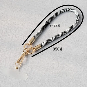 Cordon de téléphone tissé noir et blanc avec clips dorés et patch de connexion transparent