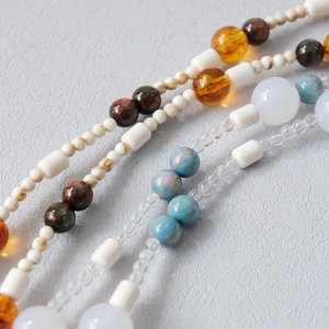 Macro shot of colorful acrylic resin beads with marbled textures for phone or bag straps