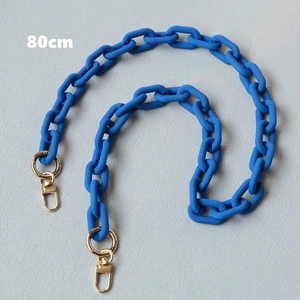 Detail showing 80cm matte blue acrylic chain link with gold metal lobster clasps