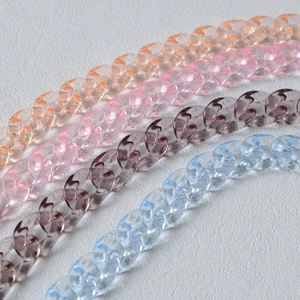 Macro view of transparent acrylic resin link chains in various vibrant colors