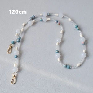 Detailed view of 120cm acrylic beaded strap with blue marble beads and gold lobster clasps