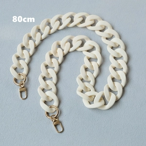 Detail view of 80cm cream matte resin chain strap with gold lobster clasps