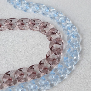 Close-up of translucent pastel pink and blue acrylic fishbone resin chain links