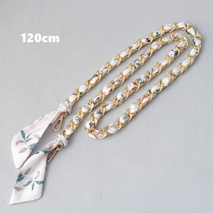 Close-up of 120cm gold chain strap woven with green floral silk scarf for handbags