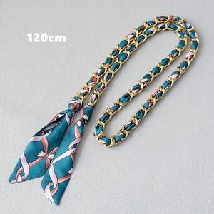 Detail of 120cm metal chain strap interwoven with dark green striped silk scarf