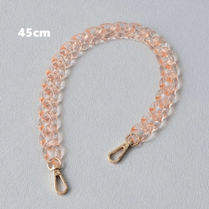 Detail view of 45cm amber orange acrylic chain strap with gold lobster clasps