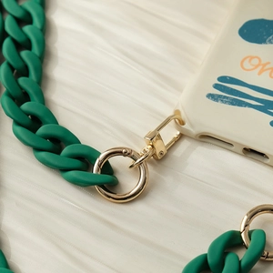 Detail of matte green resin chain with gold metal spring clasp and art print phone case