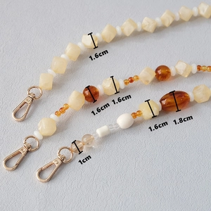 Macro view of acrylic resin beads showing dimensions of the strap accessory