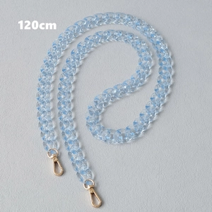 Detail of a 120cm light blue translucent acrylic chain with gold metal lobster clasps