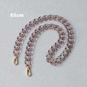 Close-up of 85cm translucent smoky gray acrylic bag chain with golden metal lobster clasps