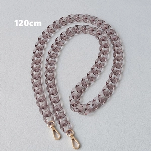 Detail view of a 120cm translucent grey resin fishbone chain with gold lobster clasps