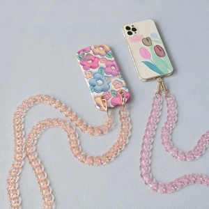 Detail of colorful acrylic resin fishbone chain on floral smartphone cases