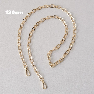 Detailed view of a 120cm gold metal chain strap with lobster clasps for handbags